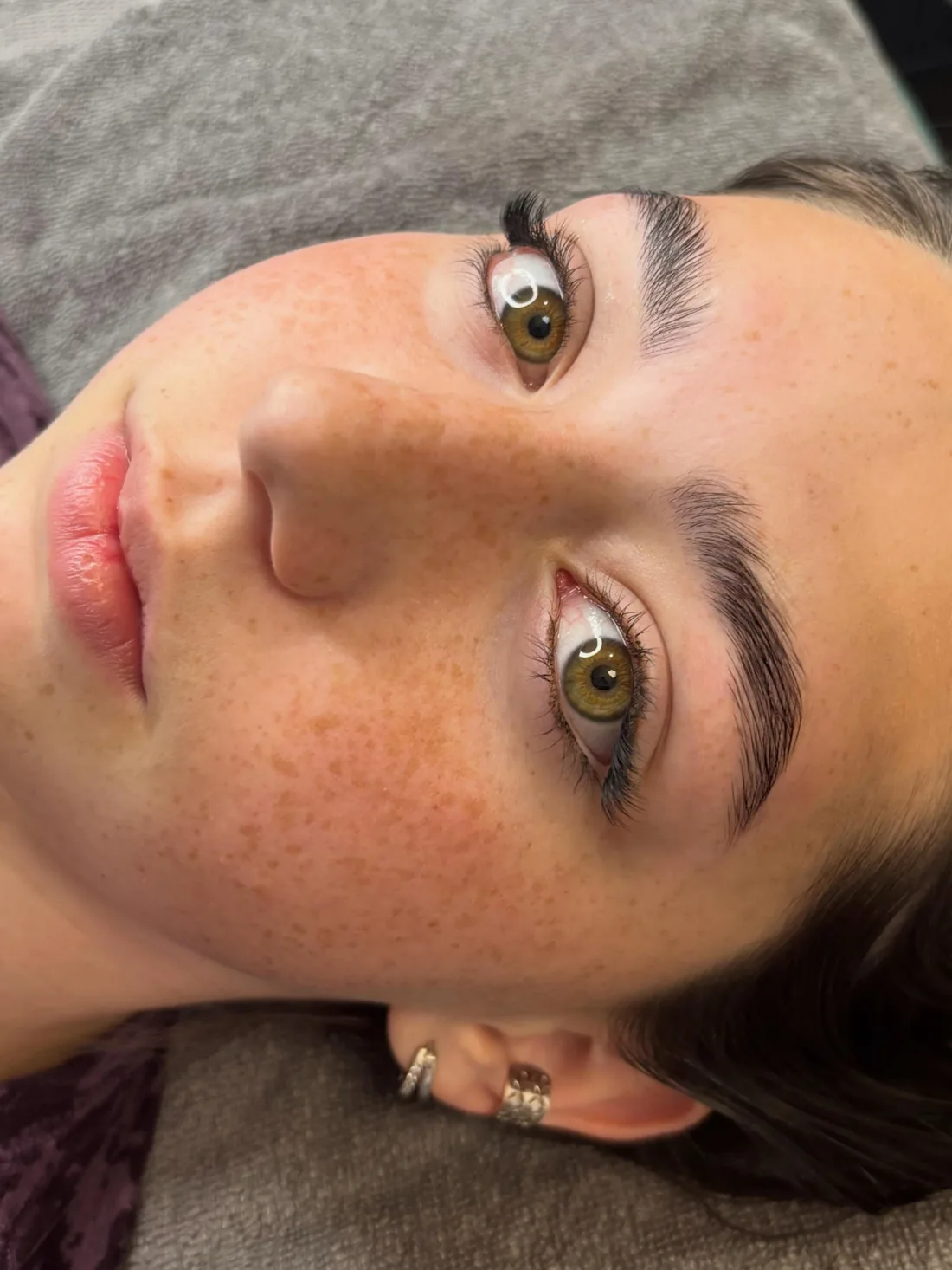 Client with glowing skin after a facial