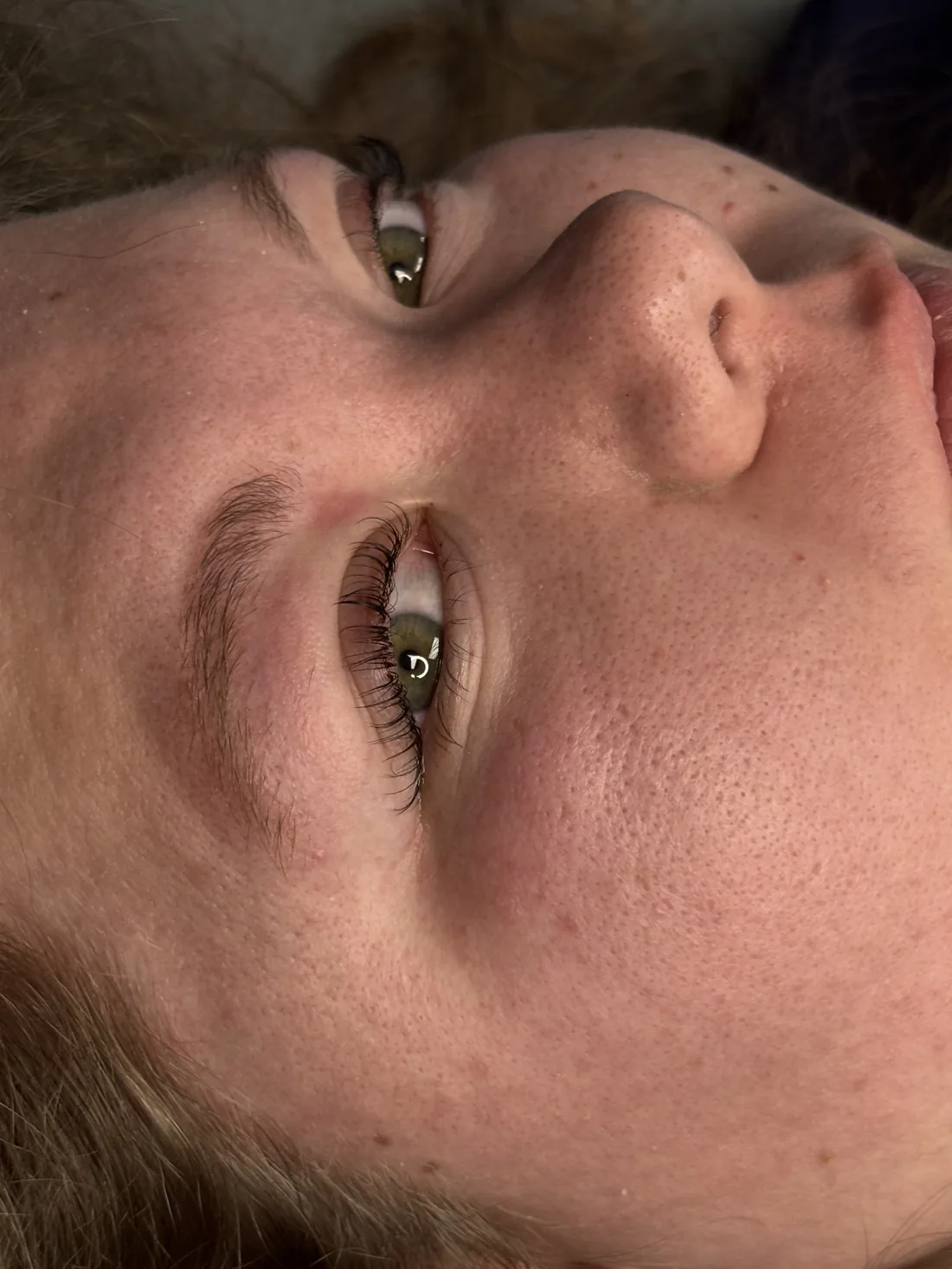 Second angle of a finished lash lift with curled lashes